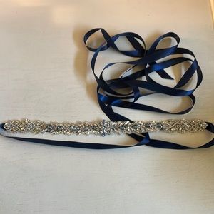Rhinestone belt with navy ribbon.